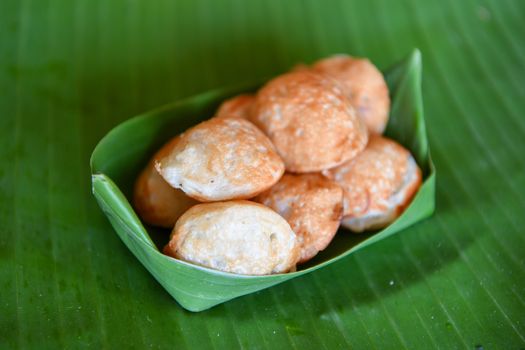 Knmcrk, made from coconut milk with sugar and flour, Thai traditional dessert.