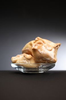 Freshness pastry on glass saucer against nice dark background