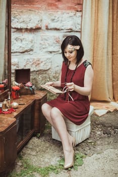 retro girl sitting at a dressing table with a letter in your hands