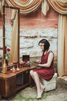 retro girl sitting at a dressing table with a letter in your hands