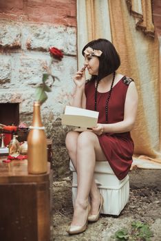 retro girl sitting at a dressing table with a letter in your hands