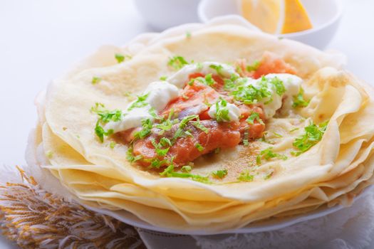 Crispy crepes with smoked salmon  and  cream cheese.