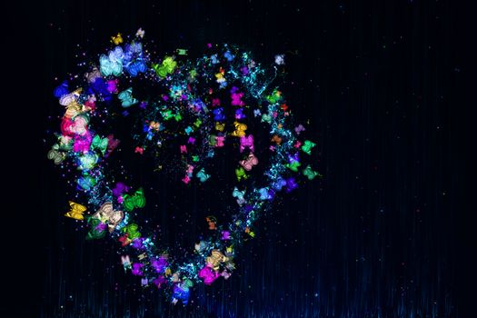 Heart made of multi-colored butterflies, stars and dots