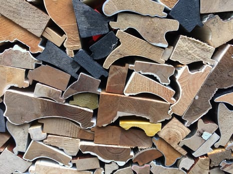 Cross sections of wooden frames corners.  Closeup of wooden boards stacked together.