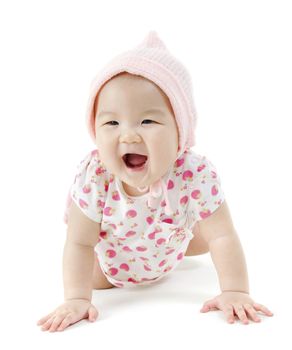 Portrait of full length beautiful Asian baby girl in pink clothes crawling on floor, isolated on white background.