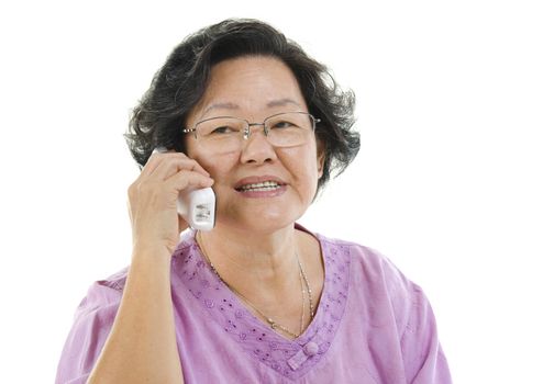 Portrait of Asian senior adult woman calling on phone, isolated on white background.