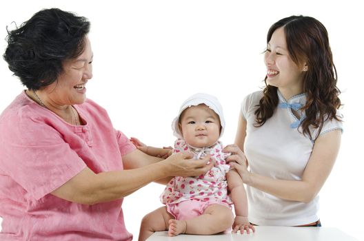 Portrait of happy multi generations Asian family, senior woman, adult daughter and baby girl, isolated on white background.