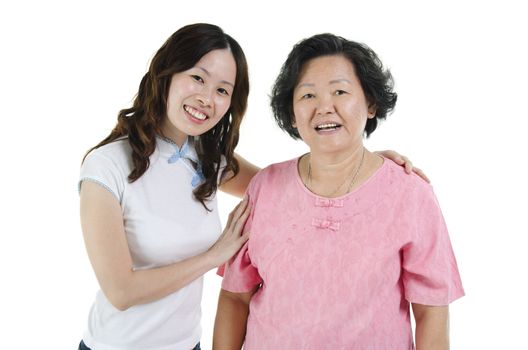 Portrait of Asian adult daughter and senior mother smiling looking at camera, isolated on white background.