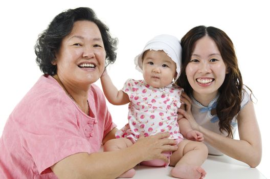 Portrait of happy multi generations Asian family, grandmother, mother and grandchild, isolated on white background.
