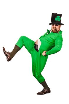 Photo of a man in a Leprechaun costume being silly and smoking a cigar.
