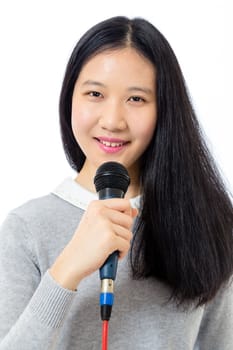 Chinese teenage girl holding microphone