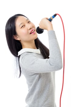 Chinese teenage girl holding microphone