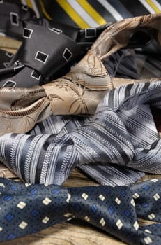 a variety of neckties knotted closeup