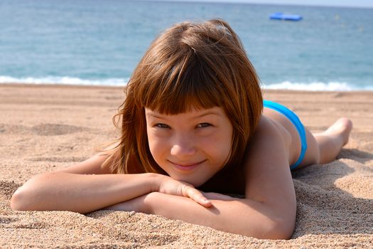 Sunbathing and swimming a pleasure for a child