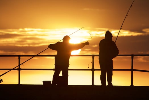 Fishing men at Mordialloc Beach, Port Phillip Bay, Melbourne, Australia