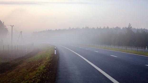 morning mist over multilane highway