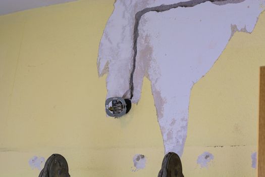 Electrical renovations in an old house. The installation of new power lines cable for power, Internet or telephone.