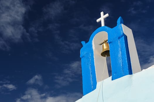 Blue and white orthodox church bell tower. Oia, Santorini Greece. Copyspace