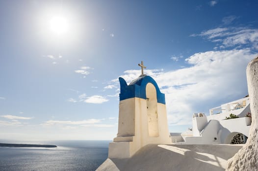 Blue and white orthodox church bell tower. Oia, Santorini Greece. Copyspace