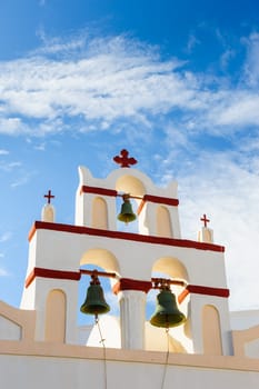 White orthodox church bell tower. Oia, Santorini Greece. Copyspace