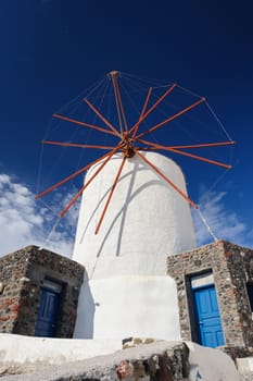 View of Oia windmill at the Island Santorini, Greece. Lot of copyspace.