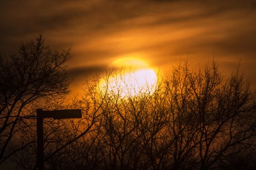 A hazy sunset in Brooklyn Park, Minnesota.