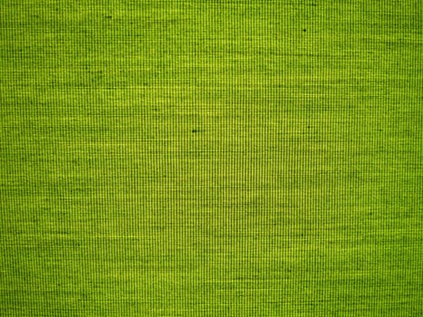 Fabric Cloth Texture Background in bright green color close up