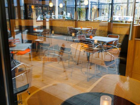 Modern Classical Design Coffee Shop Cafe Restaurant Interior via Blurred Window Image