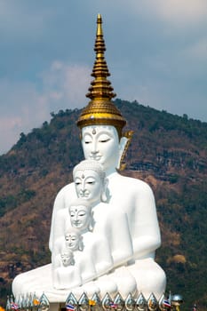 Phetchabun, Thailand - February 23.2017: Buddha statues and colored foot path colorful glass stacked in Wat Pha Kaew, Khao Kho, Phetchabun on February 23.2017 at Thailand.There. A famous Buddhist temple.