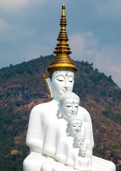 Phetchabun, Thailand - February 23.2017: Buddha statues and colored foot path colorful glass stacked in Wat Pha Kaew, Khao Kho, Phetchabun on February 23.2017 at Thailand.There. A famous Buddhist temple.