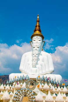 Phetchabun, Thailand - February 23.2017: Buddha statues and colored foot path colorful glass stacked in Wat Pha Kaew, Khao Kho, Phetchabun on February 23.2017 at Thailand.There. A famous Buddhist temple.