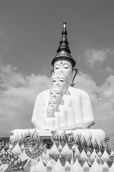 Phetchabun, Thailand - February 23.2017: Buddha statues and colored foot path colorful glass stacked in Wat Pha Kaew, Khao Kho, Phetchabun on February 23.2017 at Thailand.There. A famous Buddhist temple.