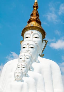 Phetchabun, Thailand - February 23.2017: Buddha statues and colored foot path colorful glass stacked in Wat Pha Kaew, Khao Kho, Phetchabun on February 23.2017 at Thailand.There. A famous Buddhist temple.