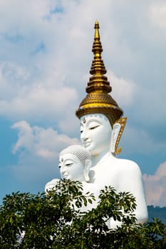 Phetchabun, Thailand - February 23.2017: Buddha statues and colored foot path colorful glass stacked in Wat Pha Kaew, Khao Kho, Phetchabun on February 23.2017 at Thailand.There. A famous Buddhist temple.