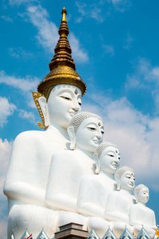 Phetchabun, Thailand - February 23.2017: Buddha statues and colored foot path colorful glass stacked in Wat Pha Kaew, Khao Kho, Phetchabun on February 23.2017 at Thailand.There. A famous Buddhist temple.