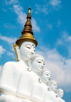 Phetchabun, Thailand - February 23.2017: Buddha statues and colored foot path colorful glass stacked in Wat Pha Kaew, Khao Kho, Phetchabun on February 23.2017 at Thailand.There. A famous Buddhist temple.