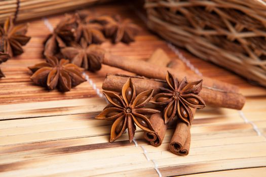 cinnamon and star anise on a bamboo napkin close up
