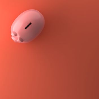 TOP VIEW OF PIGGY BANK ON ORANGE BACKGROUND