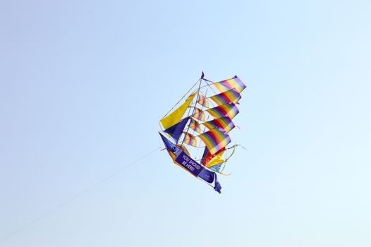 Kite-shaped boat and with rainbow colors on the beach of Bamburi in Kenya