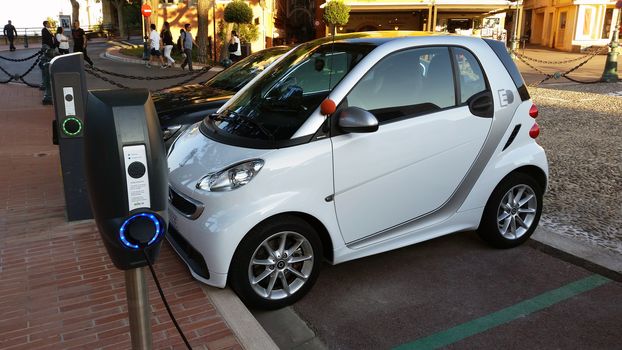 Monaco-Ville, Monaco - October 4, 2016: Small Smart Fortwo Electric Car at Charging Station in the City Street in Monaco-Ville, French Riviera
