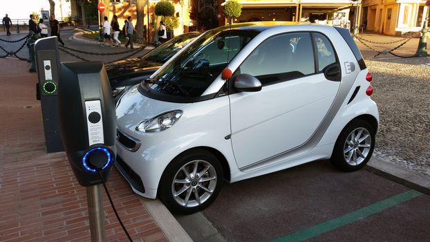 Monaco-Ville, Monaco - October 4, 2016: Small Smart Fortwo Electric Car at Charging Station in the City Street in Monaco-Ville, French Riviera
