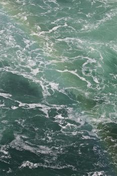 Beautiful photo of the water near amazing Niagara falls with a rainbow