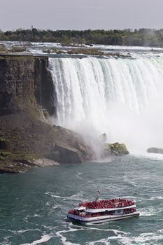 Beautiful photo of the amazing Niagara waterfall and a ship