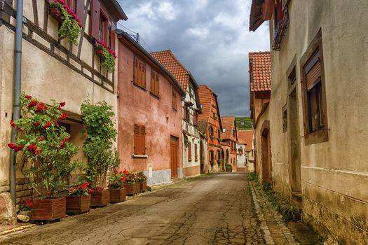 Street in Obernai city with half-timbered house, France