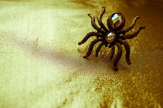 spider ring on a wooden table jewelry