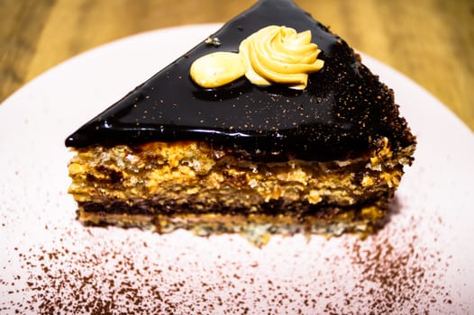 a piece of chocolate cake with nuts cocoa