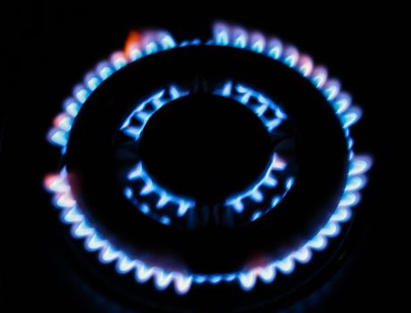 the fire of the gas stove over black background