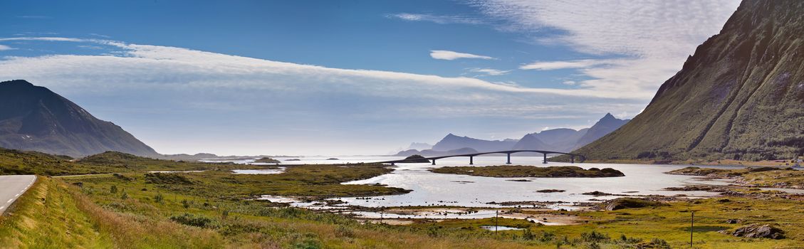 Fantastic bridge through fjord on Lofoten islands in Norway. Travel background. Sunny summer landscape panorama