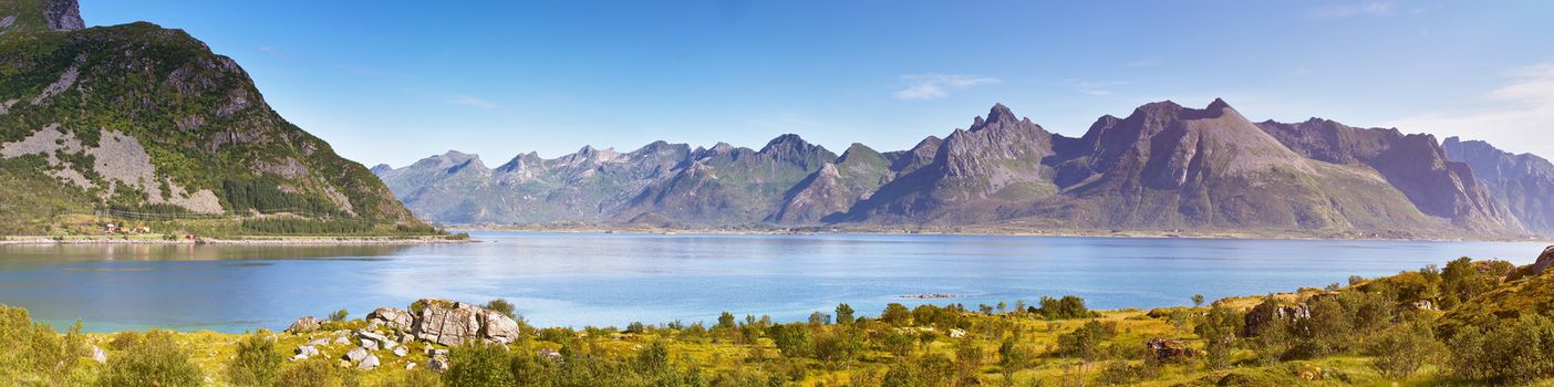 Norway landscape sunny summer panorama, fjord and mountains in the background