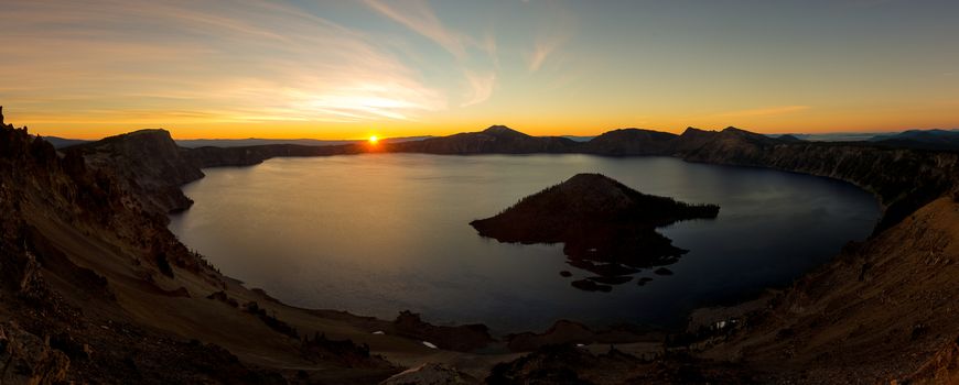 Crator lake sunrise panorama with orange sky